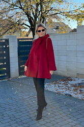a lady in a red wool coat